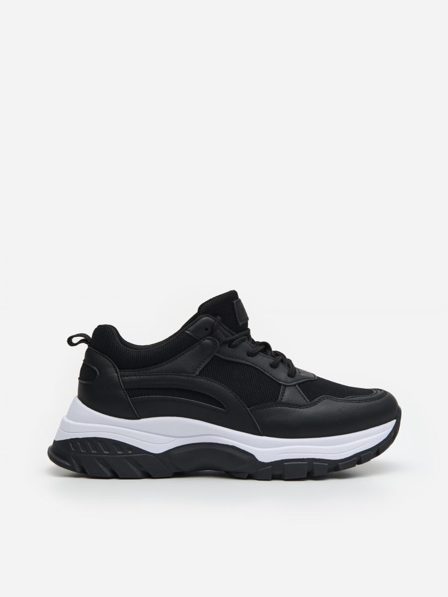 black thick sole trainers