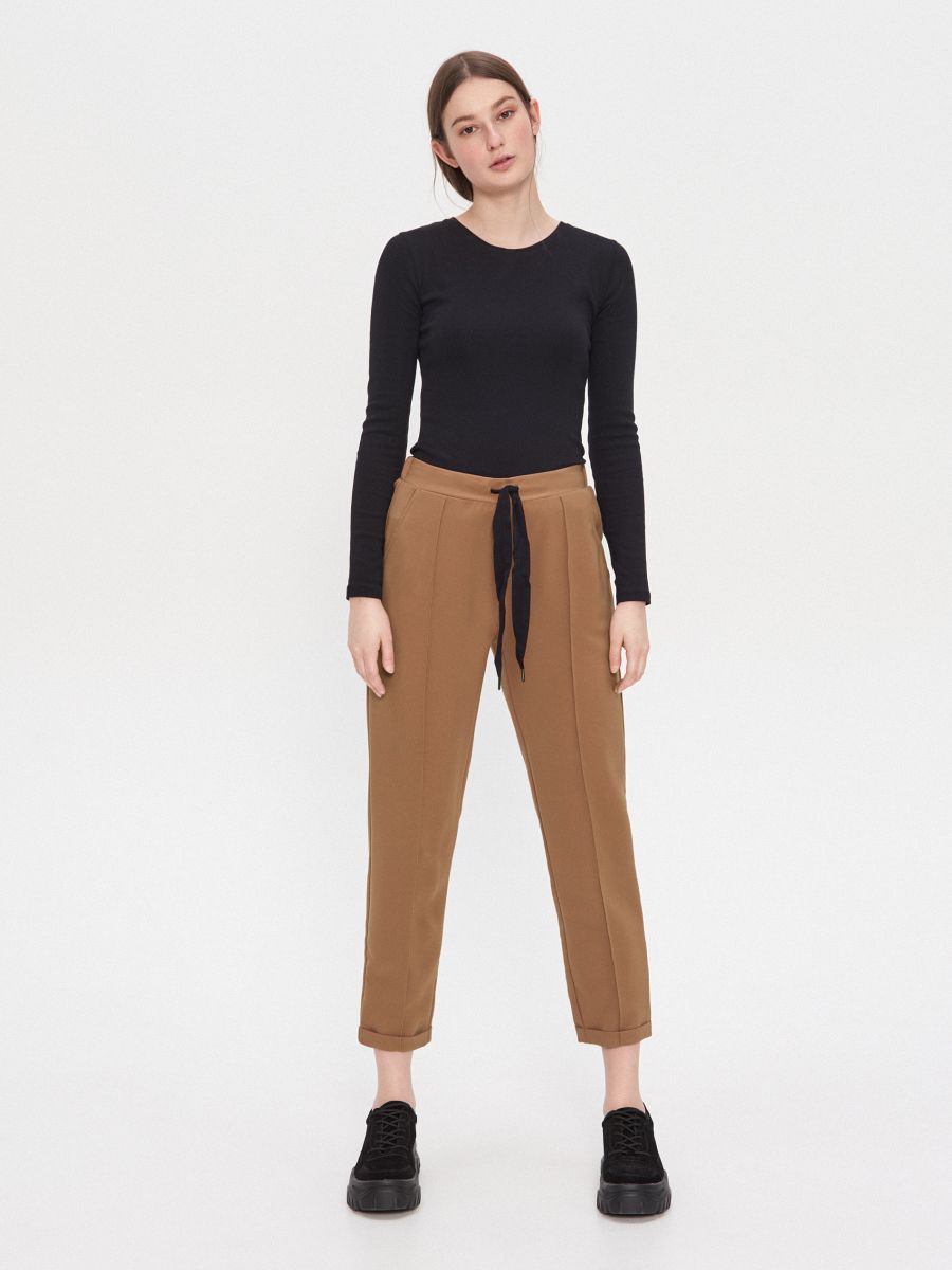 beige cigarette trousers